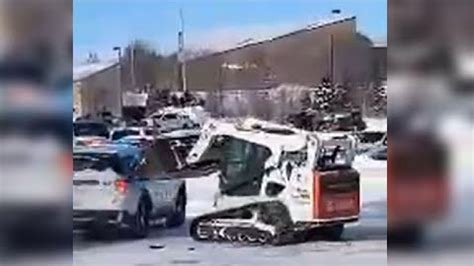 skid steer hits police car|Video: Man rams Neb. cruisers, other cars with skid loader .